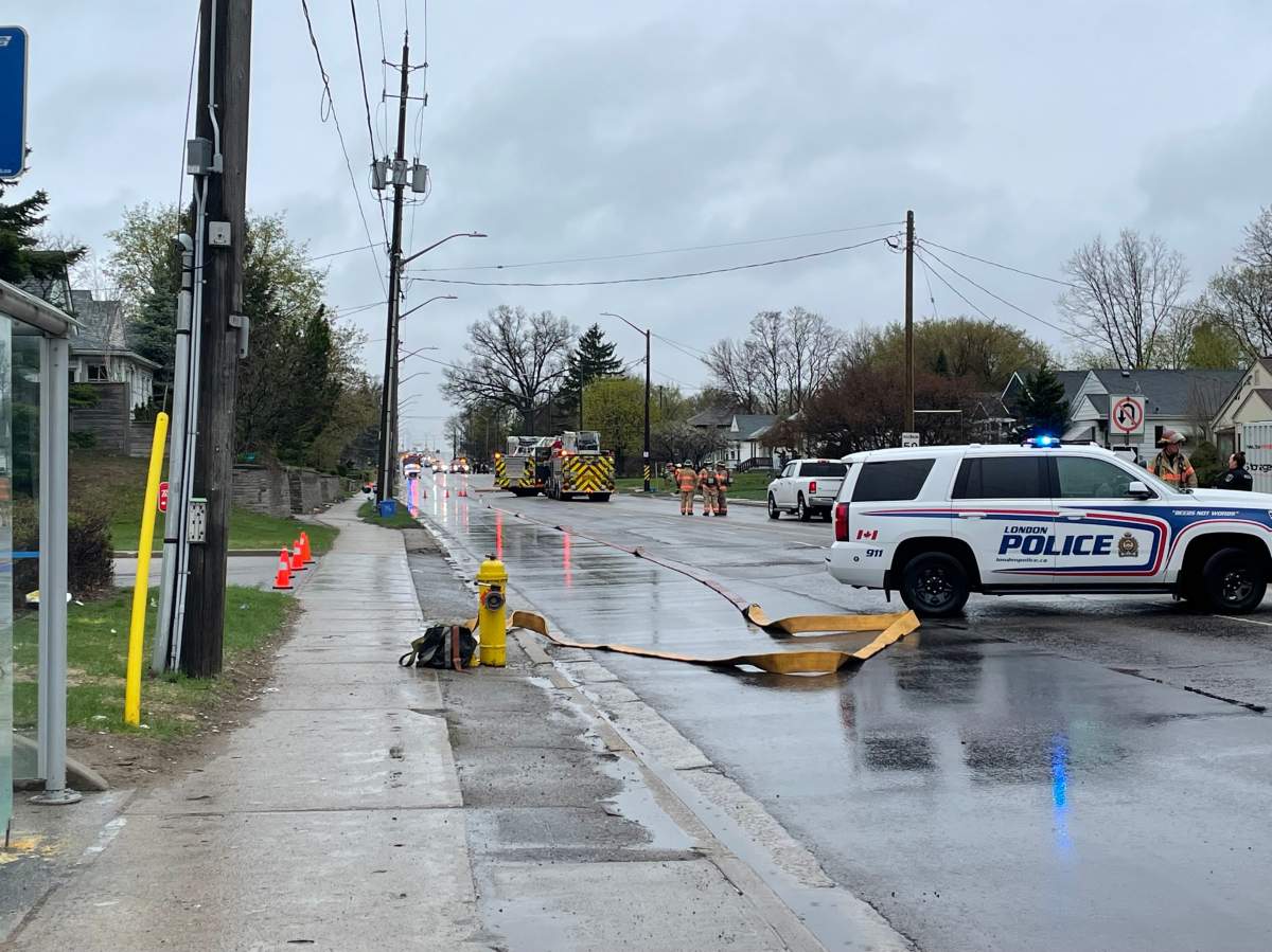 London police and fire vehicles along a stretch of Highbury Avenue on a rainy April 17, 2023.