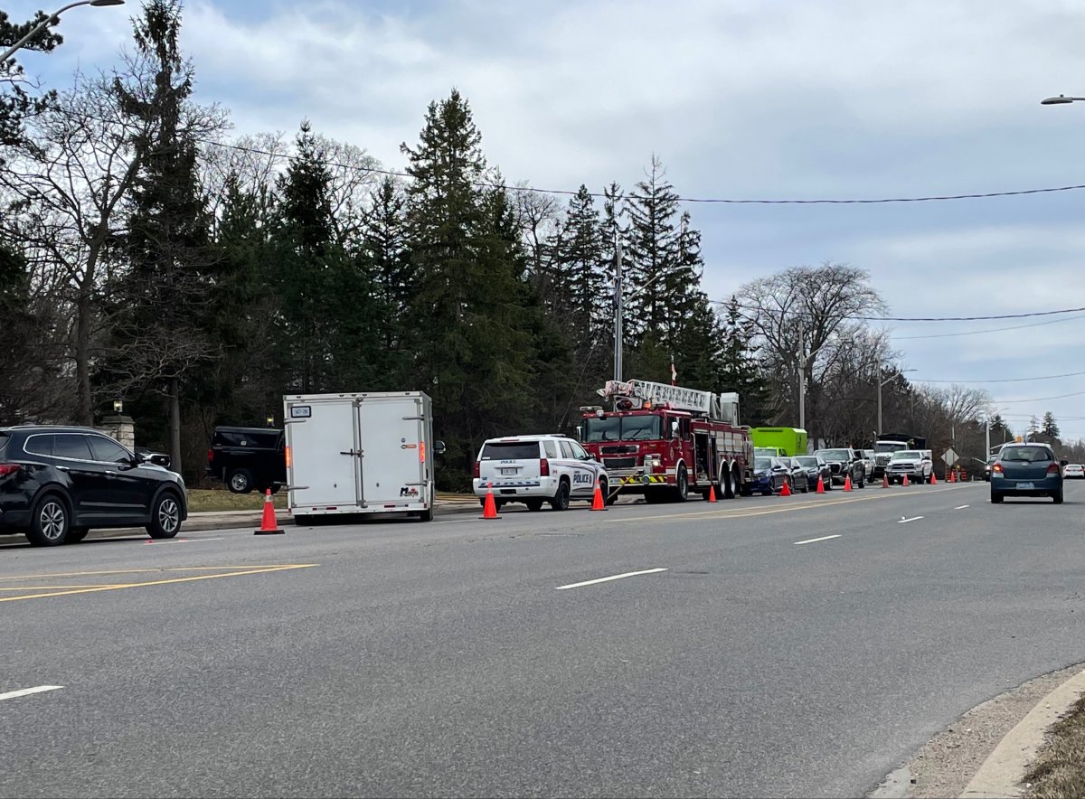 Police, fire and other vehicles are seen stationed outside 467 Commissioners Rd. E. in London, Ont., on April 6, 2023.