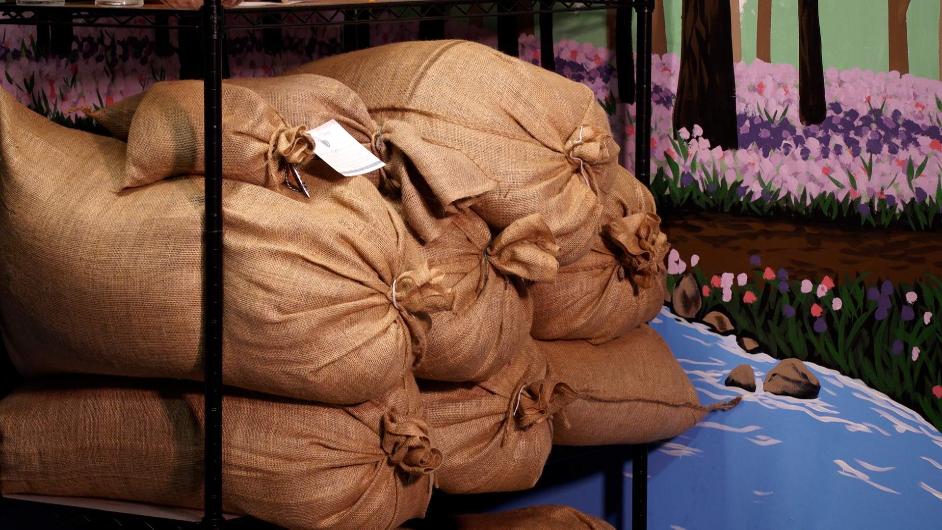 Burlap bags of human compost at Return Home