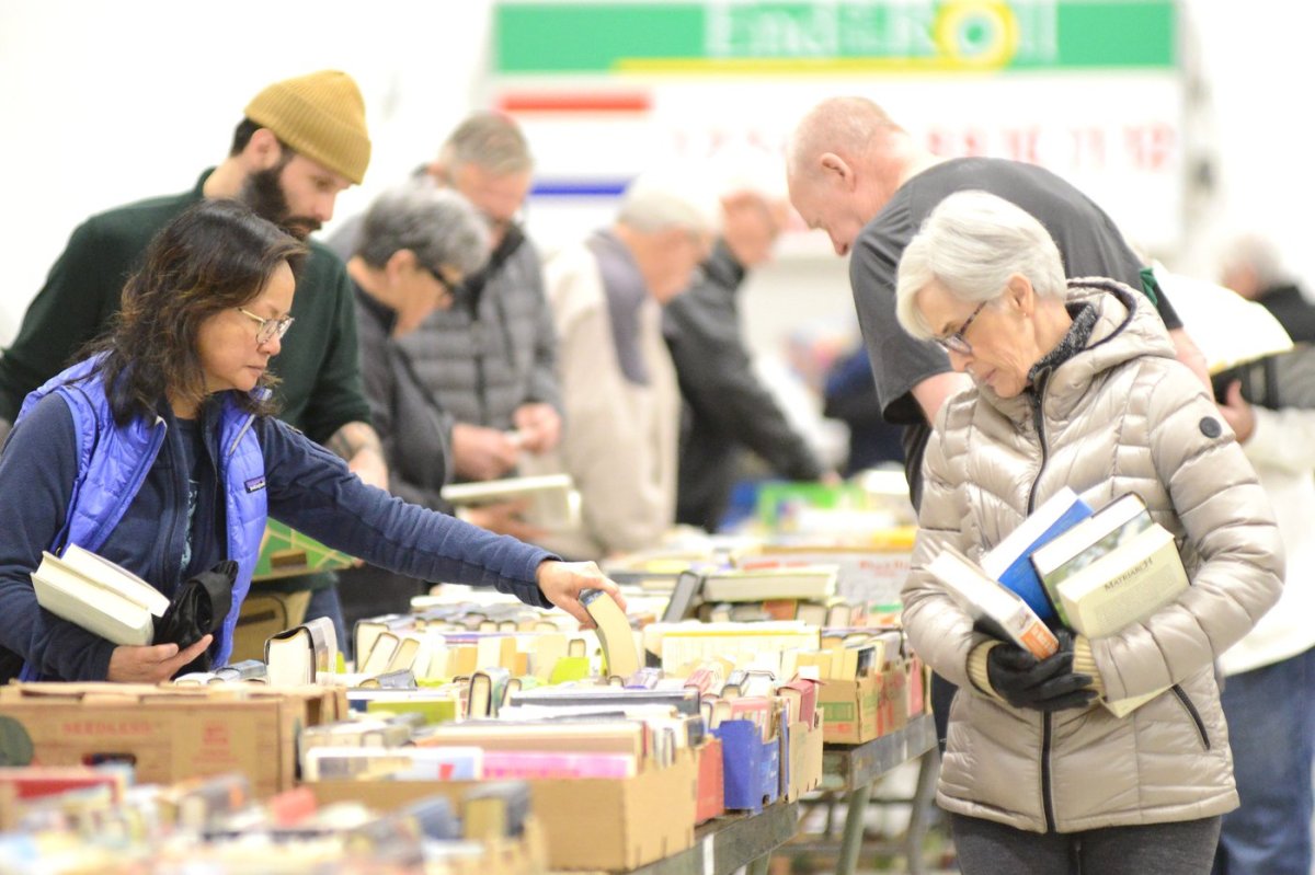 Shoppers sort through the thousands of used books for sale the Penticton Sunrise Rotary sale on until Saturday at the Penticton Curling Club.
