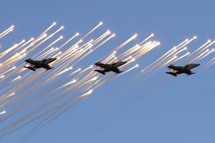 Belarusian army Su-25 jet fighters fly during a parade