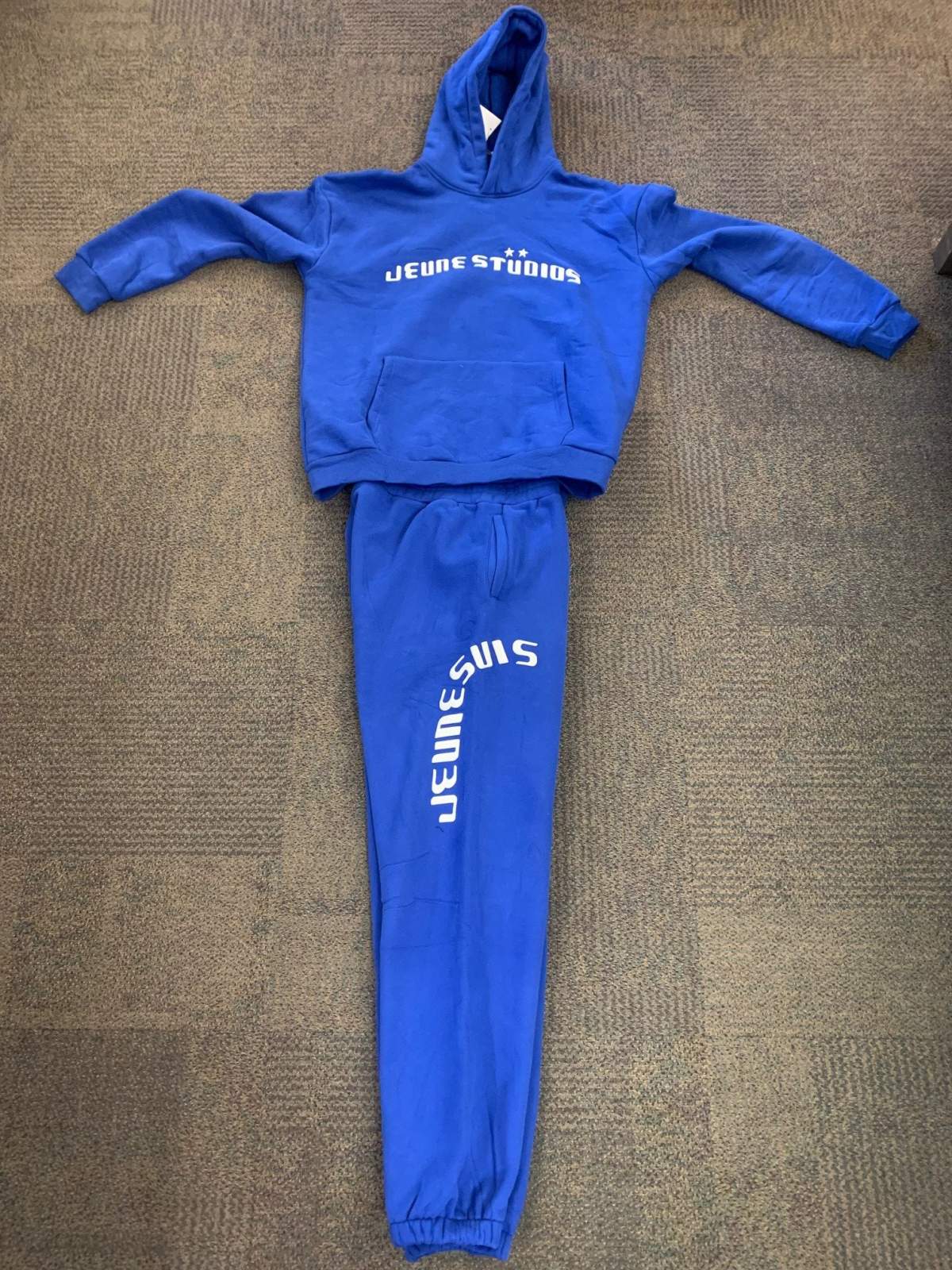 A distinctive “Jeune Studios” blue tracksuit worn by a person of interest seen with the shooter in the homicide of Usama Ibrahinadan, 20, near 144 Avenue and 72 Street in the Londonderry area on March 15, 2023.