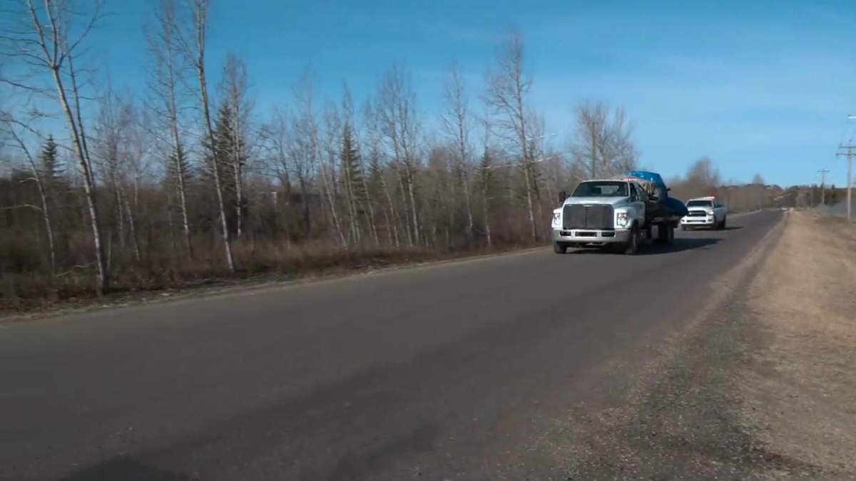A damaged RCMP cruiser is taken away from the scene on Township Road 540 in Strathcona County where RCMP Const. Harvinder (Harvey) Singh Dham died in a collision on Monday, April 10, 2023.