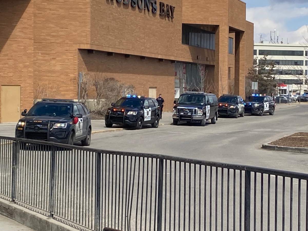 Police vehicles are seen outside Sunridge Mall, pictured on April 14, 2023.