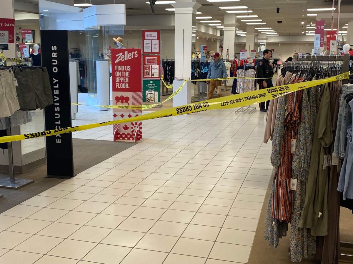 Police tape cordons off an area of Hudson's Bay within Sunridge Mall on April 14, 2023.