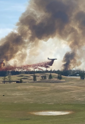 Emergency crews fighting a wildfire near Trestle Creek Golf Resort in Parkland County on Saturday, April 29, 2023.