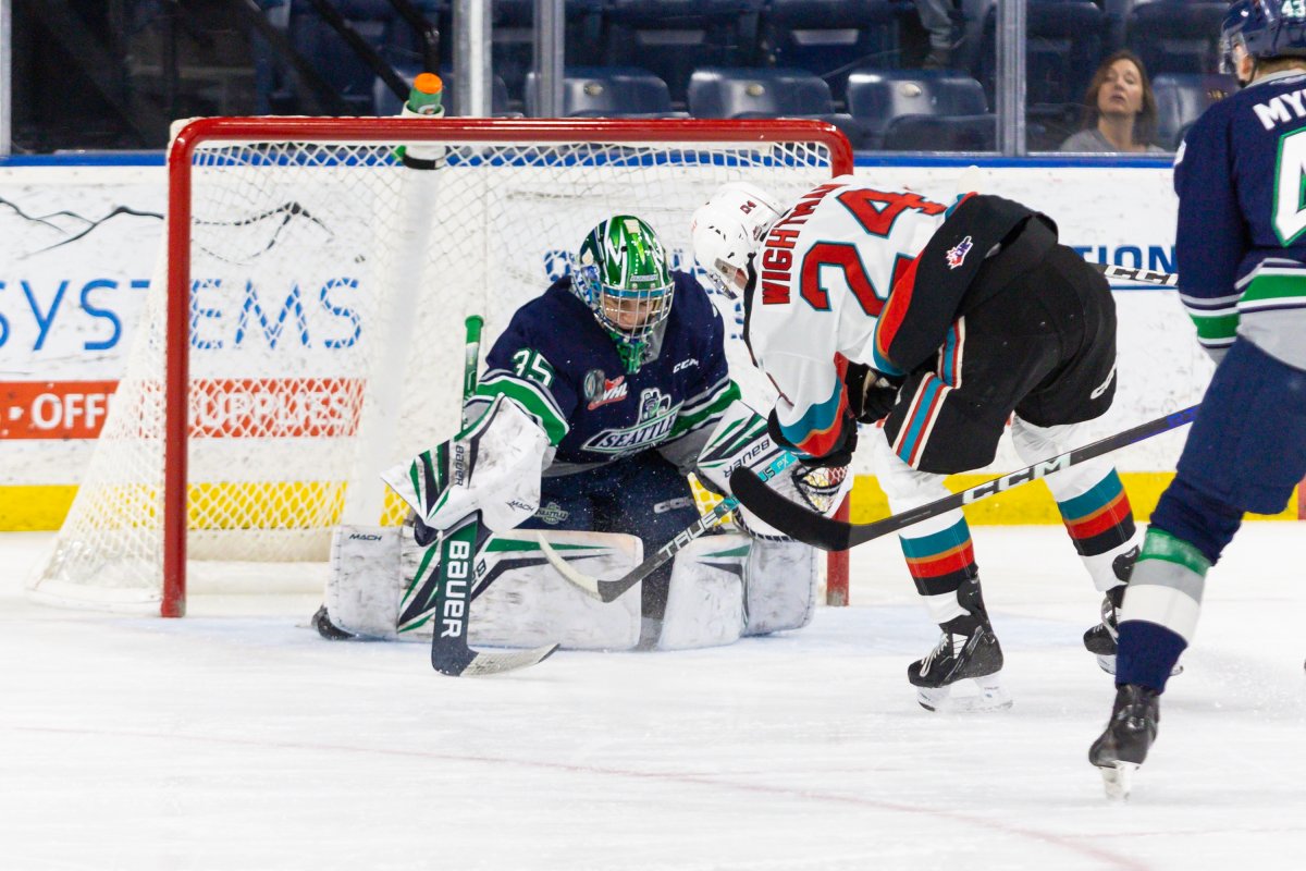 Seattle goaltender Thomas Milic, who backstopped Canada to gold at the 2023 world juniors, reaches for the puck during WHL playoff action against the Kelowna Rockets in Kelowna, B.C., on Tuesday, April 4, 2023.