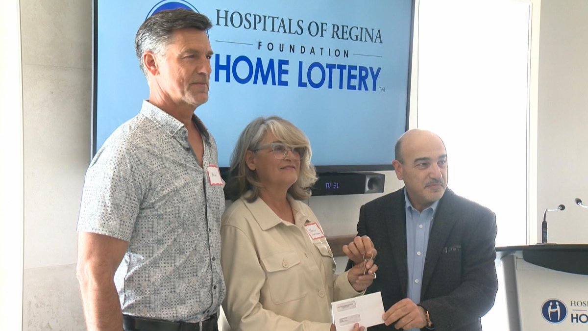 Janice and Brian Burgess receive the keys to their new $1.5 million showhome from the Hospitals of Regina Foundation Home Lottery.