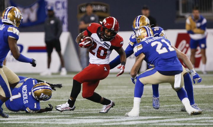 Calgary Stampeders' Peyton Logan (20) makes yards against the Winnipeg Blue Bombers during the second half CFL action in Winnipeg Thursday, August 25, 2022.