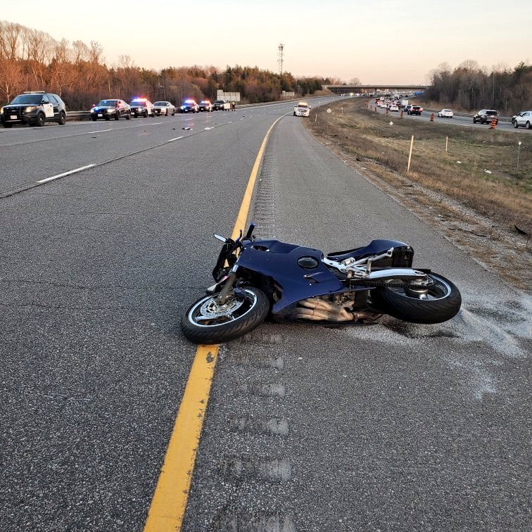 A motorcyclist has been taken to hospital after a collision along Highway 404 in Aurora, police say.