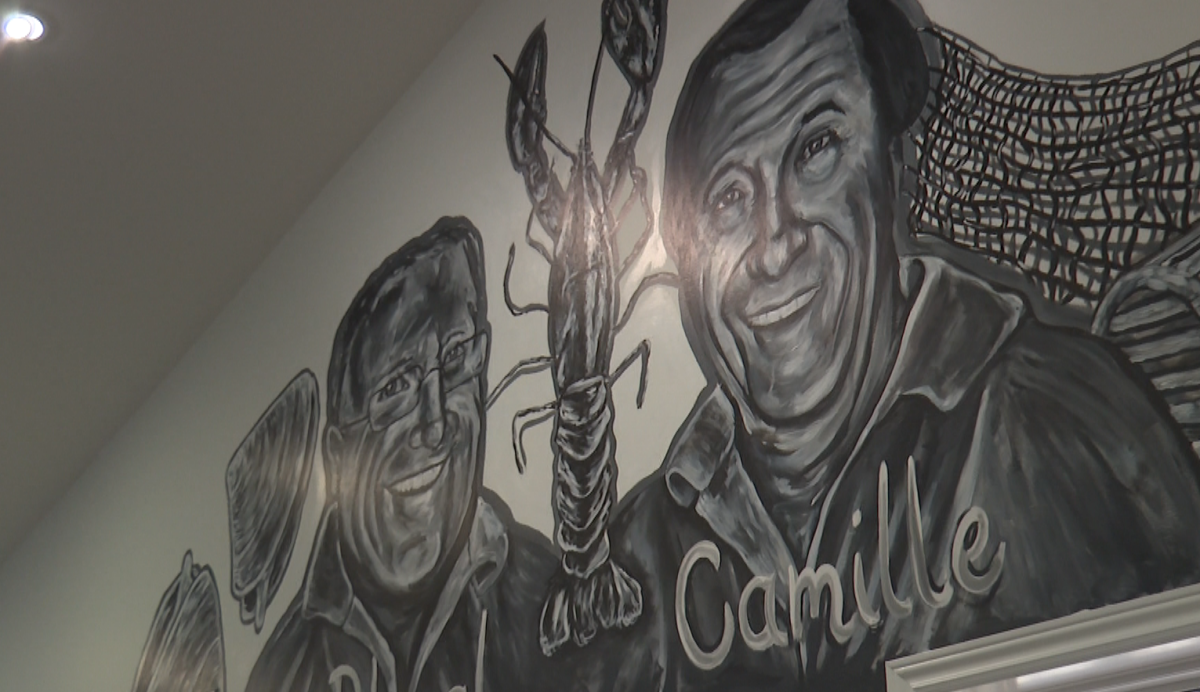 A mural inside the restaurant depicts the original owners with a lobster