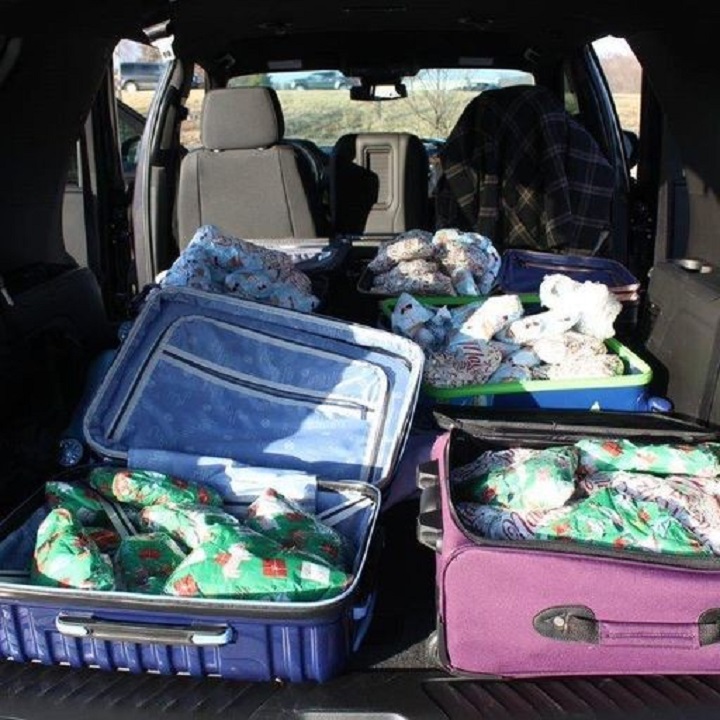 Illegal firearms wrapped in bubble wrap, holiday paper inside suitcases in a Chicago vehicle destined for Canada, Toronto police allege.