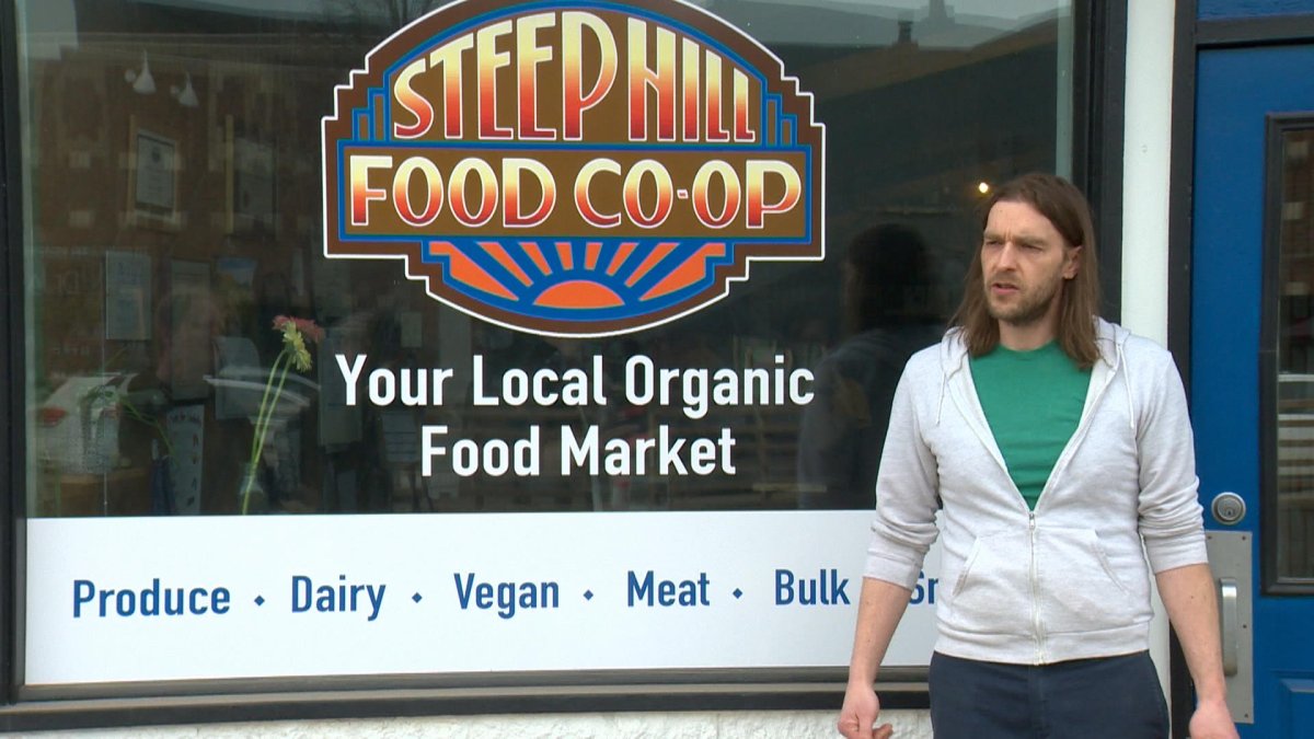Marcel Vogt, store manager, in front of the Steep Hill Food Co-op on Broadway, Saskatoon.