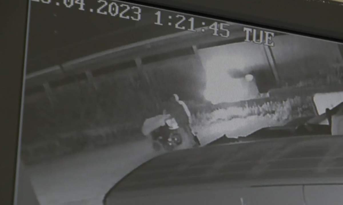 Security video appears to show a person with a cart casually walk away after setting a mattress on fire.