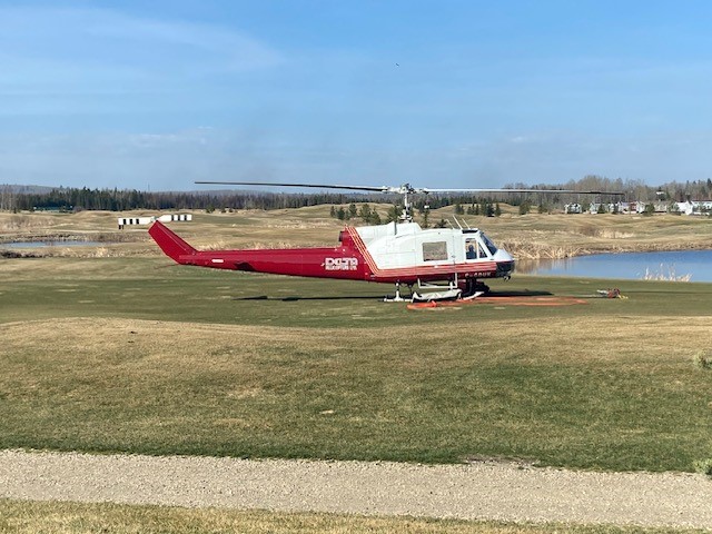 Parkland County fire crews going over their plan Monday, May 1, 2023, at Trestle Creek golf course where their command centre is.