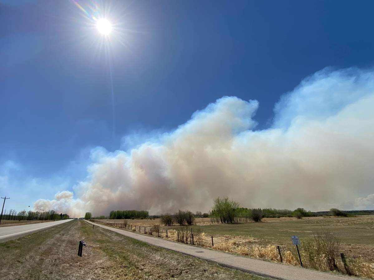 A 1,500-hectare, out-of-control wildfire burns near Drayton Valley, Alta., on May 5, 2023.