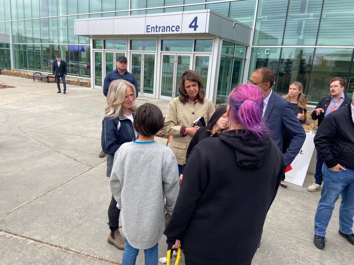 Alberta NDP leader Rachel Notley and UCP leader Danielle Smith meet wildfire evacuees at the Edmonton EXPO centre on Sunday May 7, 2023.