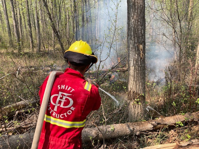Fire crews battle the Dunes West wildfire near Grande Prairie, Alberta, on May 11, 2023.