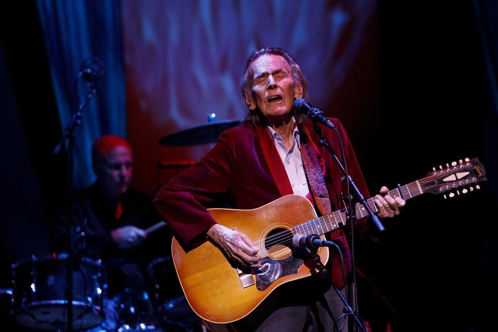 Gordon Lightfoot performs during the first concert at the newly reopened Massey Hall in Toronto on Nov. 25, 2021.