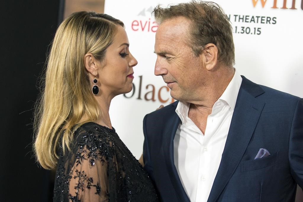 Christine Baumgartner and Kevin Costner attend the Los Angeles Premiere of "Black or White" held at Regal Cinemas, Jan 20, 2015, in Los Angeles.