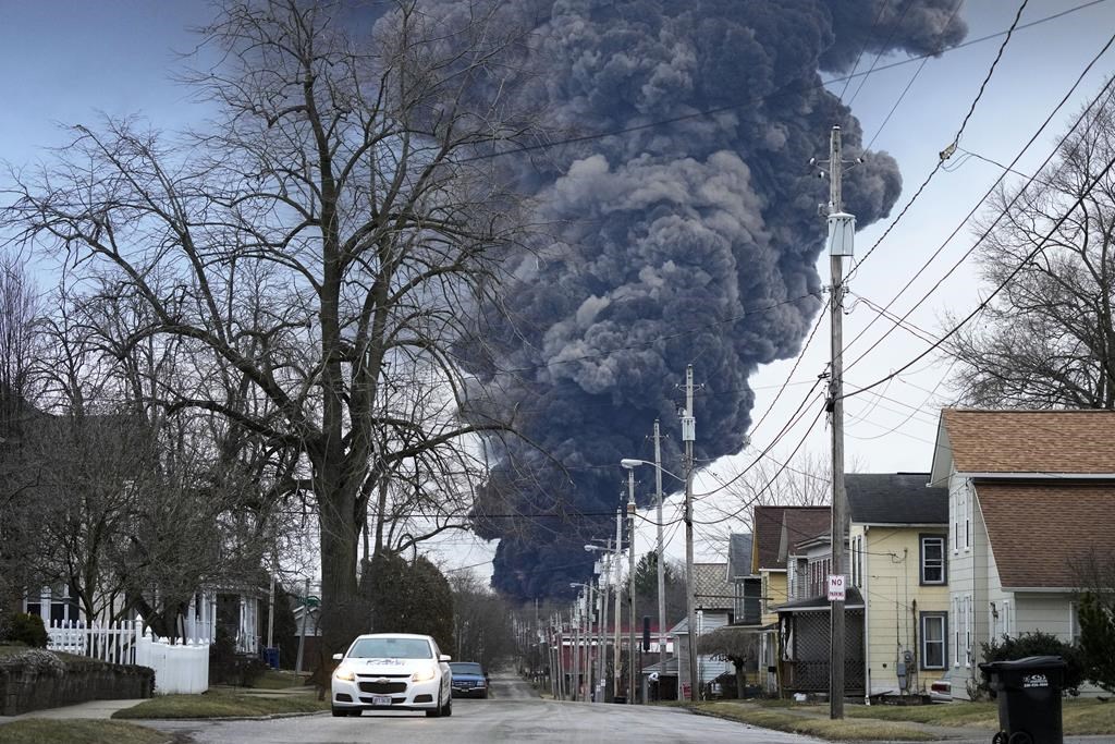 A black plume rises over East Palestine, Ohio, as a result of a controlled detonation of a portion of the derailed Norfolk Southern trains, on Feb. 6, 2023. Norfolk Southern CEO Alan Shaw is set to testify before an Ohio Senate rail safety panel on Tuesday, April 18, more than two months after the fiery train derailment rocked the village of East Palestine.