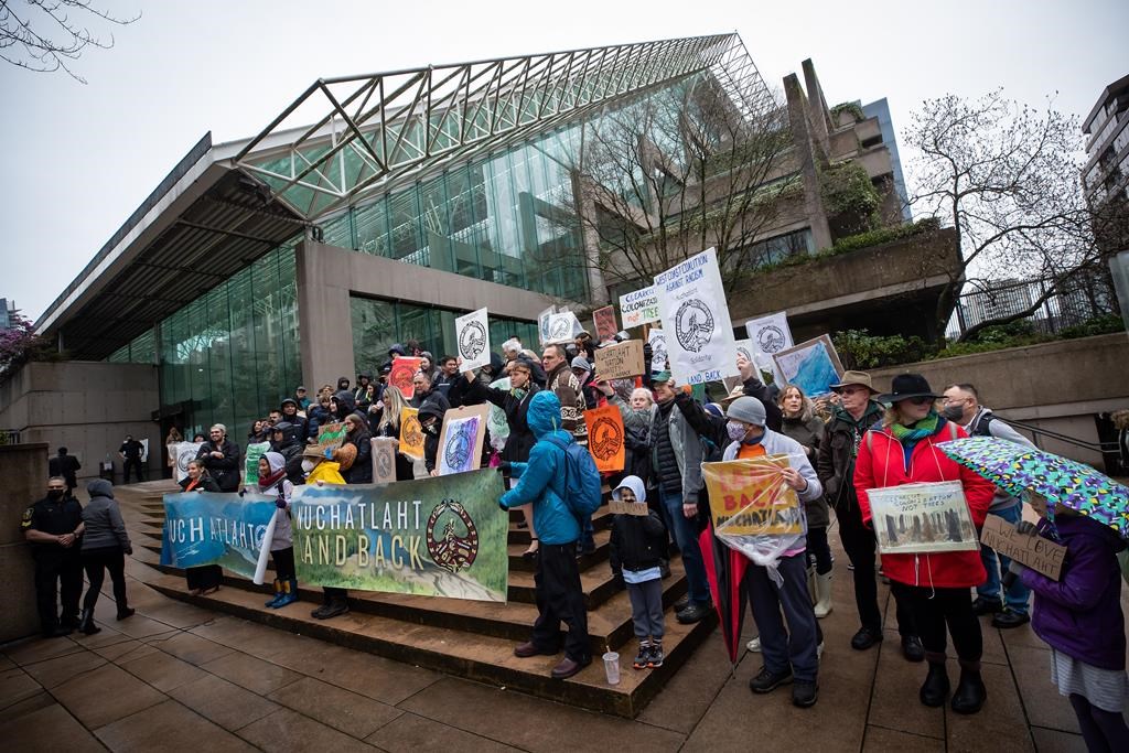 Members of the Nuchatlaht First Nation and supporters rally outside B.C. Supreme Court before the start of an Indigenous land title case, in Vancouver, on Monday, March 21, 2022.