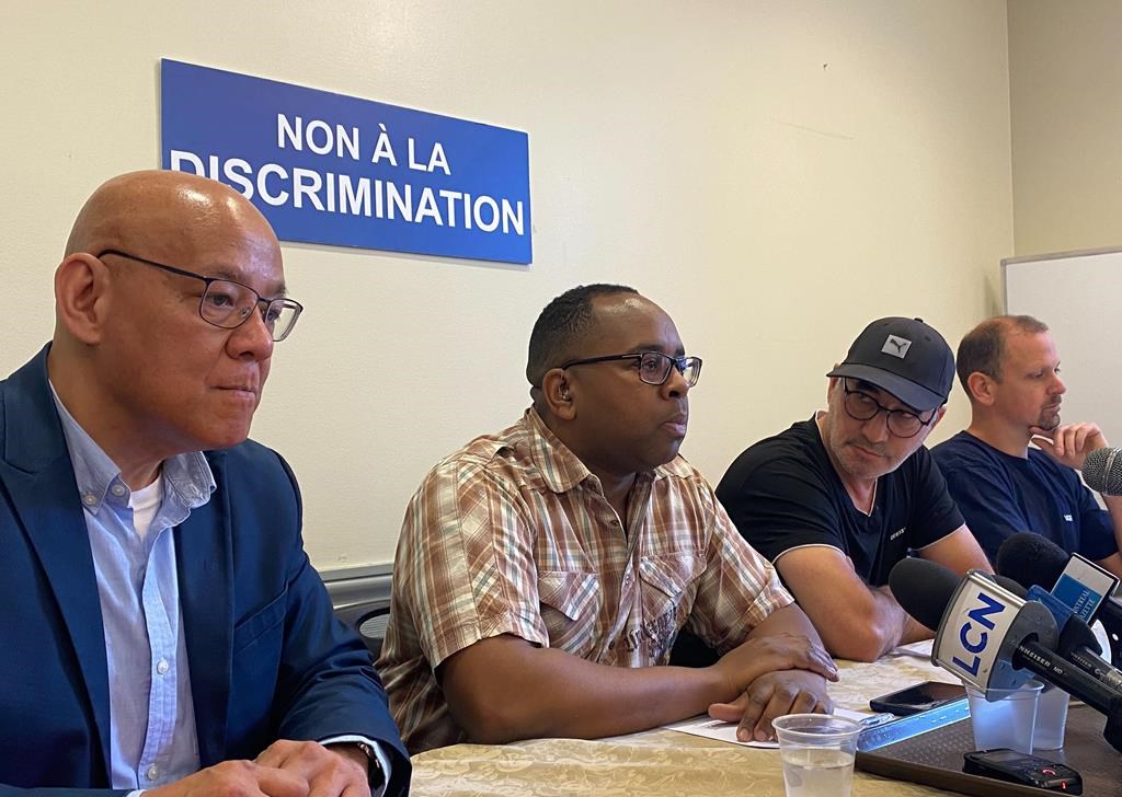 Fo Niemi (left to right), executive director of the Center for Research-Action on Race Relations, Gino Clyford Lubérisse, Haklim Tali Mamar and Patrick Roy speak at a news conference in Montreal on Friday, May 12, 2023. Some Montreal blue collar workers are calling for their union to be investigated for alleged racial bias.