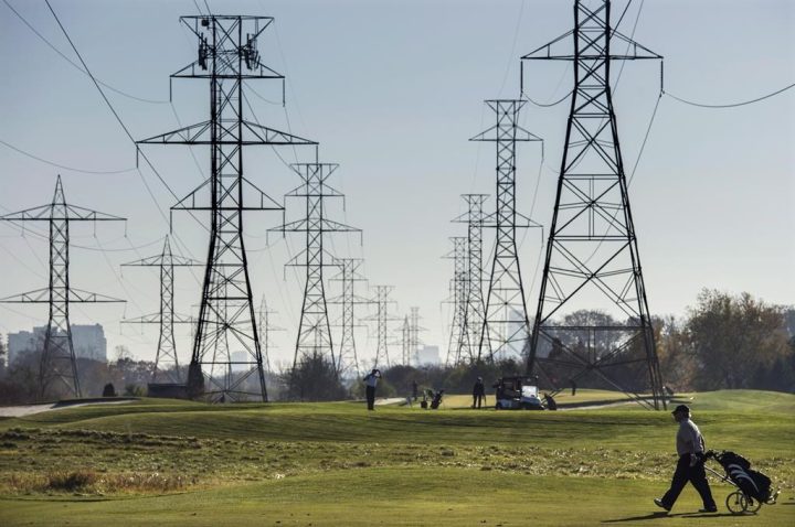 Hydro towers are seen over a golf course in Toronto on Wednesday, November 4, 2015. Ontario's electricity system operator is announcing that it is bringing seven new battery storage projects into the province's grid, to support reliability and help eventually move away from natural gas. 
