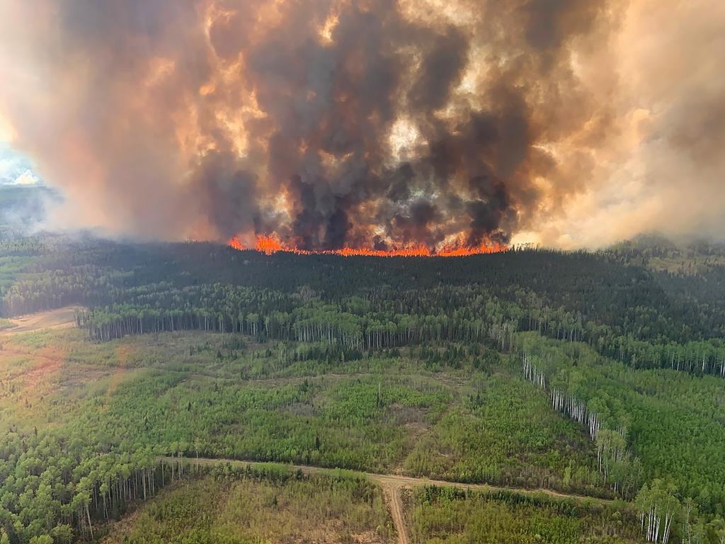 Hot and dry conditions are expected to continue as wildfires throughout Western Canada have forced thousands of evacuations and air quality warnings due to smoke as far east as northern Ontario. The Bald Mountain wildfire is shown in the Grande Prairie Forest Area on Friday May 12, 2023 in this handout image provided by the government of Alberta.