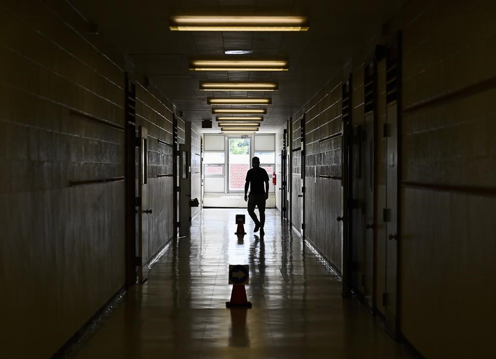 A teacher in a hallway at a school in Scarborough, Ont., on Monday, September 14, 2020. Toronto District School Board says more than 300 students have been involved in violent incidents in the city so far this school year. 