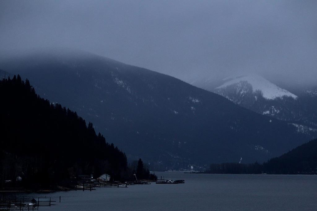Kokanee Glacier, right, is pictured shrouded by low cloud above Kootenay Lake north of Nelson, B.C., on Mon. Jan.17, 2011.
