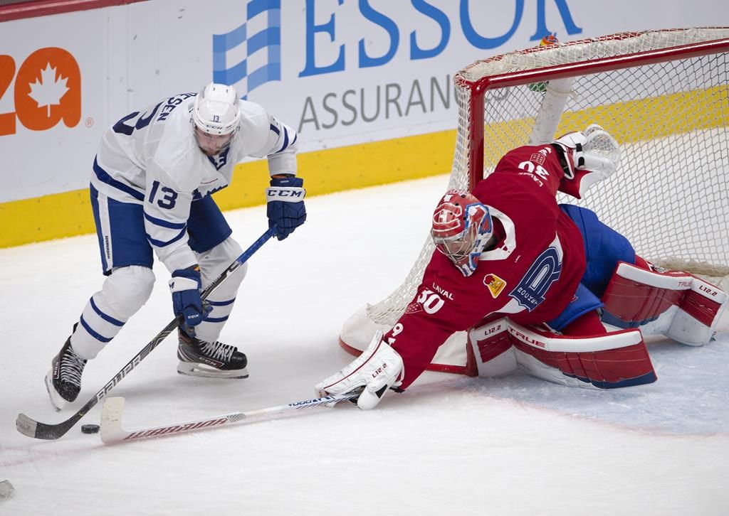 Laval Rocket goaltender Carey Price poke checks Toronto Marlies' Stefan Noesen during second period American Hockey League action in Montreal, Monday, May 17, 2021. The Marlies won't be renewing the contracts of head coach Greg Moore and assistants A.J. MacLean and John Snowden, the club announced Friday. THE CANADIAN PRESS/Ryan Remiorz.