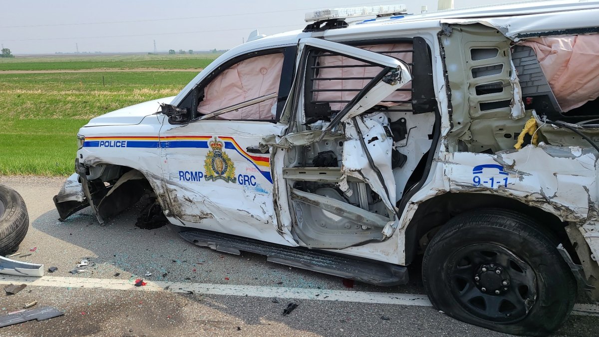 Damage to an Alberta RCMP unit after it was struck by a semi on Highway 2 near the town of Stavely, Alta. on May 19, 2023.