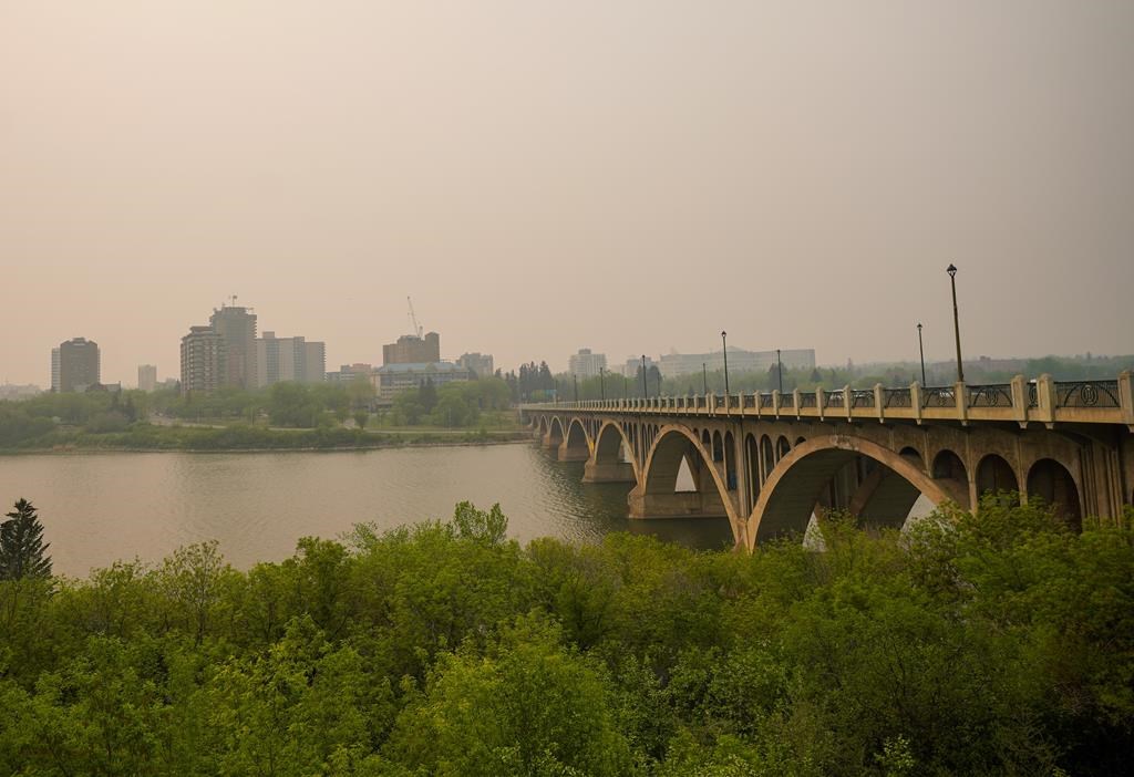 University Bridge is photographed through thick smoke from wildfires burning across the Prairies, in Saskatoon on Saturday, May 20, 2023. THE CANADIAN PRESS/Heywood Yu.