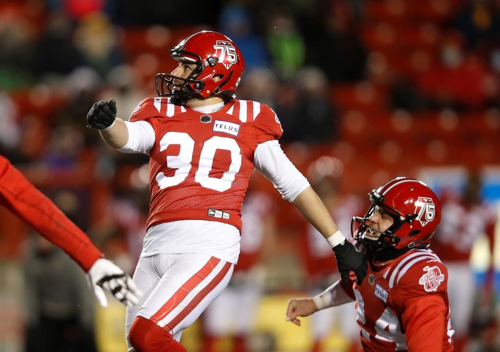 The Calgary Stampeders' Rene Paredes watches his game-winning field goal with Cody Grace against the Winnipeg Blue Bombers during the second half of their CFL football game in Calgary on November 20, 2021.