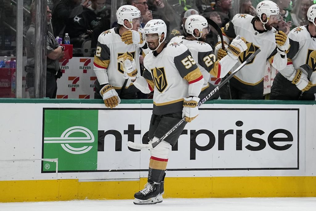 Vegas Golden Knights right wing Keegan Kolesar motions to goaltender Adin Hill (not shown) at the net while celebrating with the team after scoring against the Dallas Stars in the first period of Game 6 of the NHL hockey Stanley Cup Western Conference finals, Monday, May 29, 2023, in Dallas. (AP Photo/Tony Gutierrez).