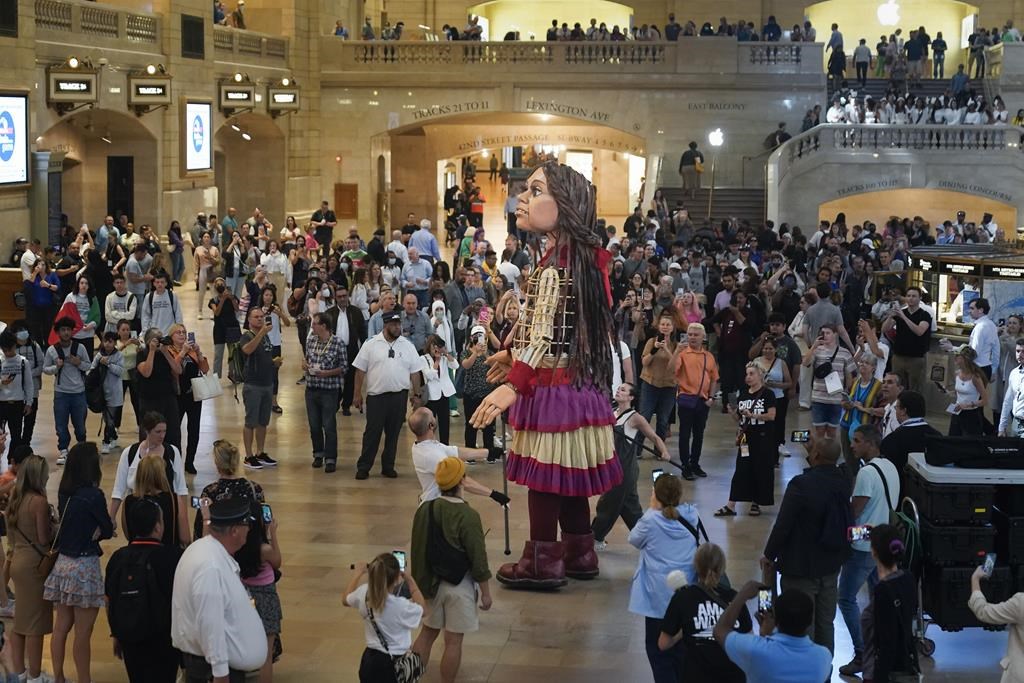 Little Amal walks around Grand Central Station in New York, on Sept. 15, 2022. Little Amal will journey across the United States this fall, visiting key places in America’s history in an attempt to raise awareness about immigration and migration.