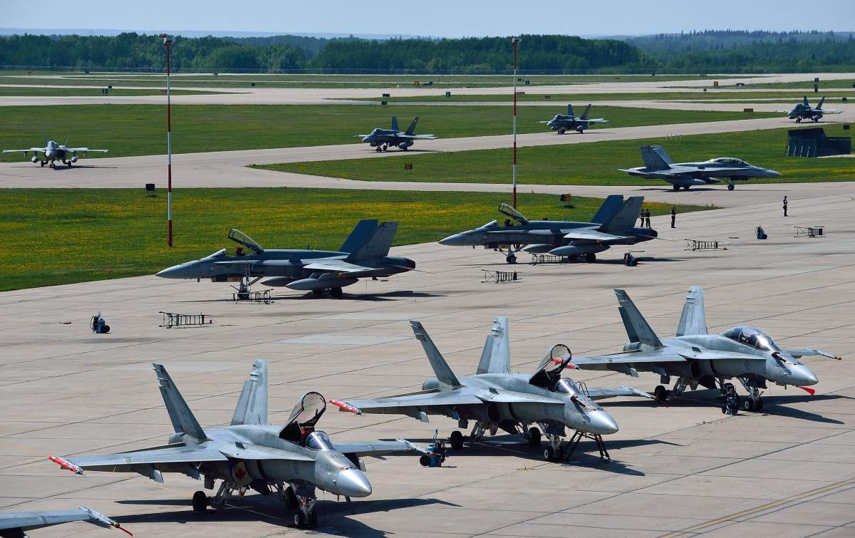 Royal Canadian Air Force CF-188 Hornet fighter aircraft participating in Exercise MAPLE FLAG 2013 (JOINTEX) taxi on the Canadian Forces Base Cold Lake tarmac in Cold Lake, Alberta on May 30, 2013.