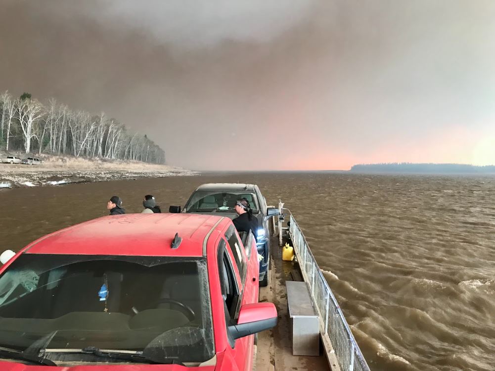 Residents of Fox Lake leaving the isolated community as an out-of-control wildfire burns.