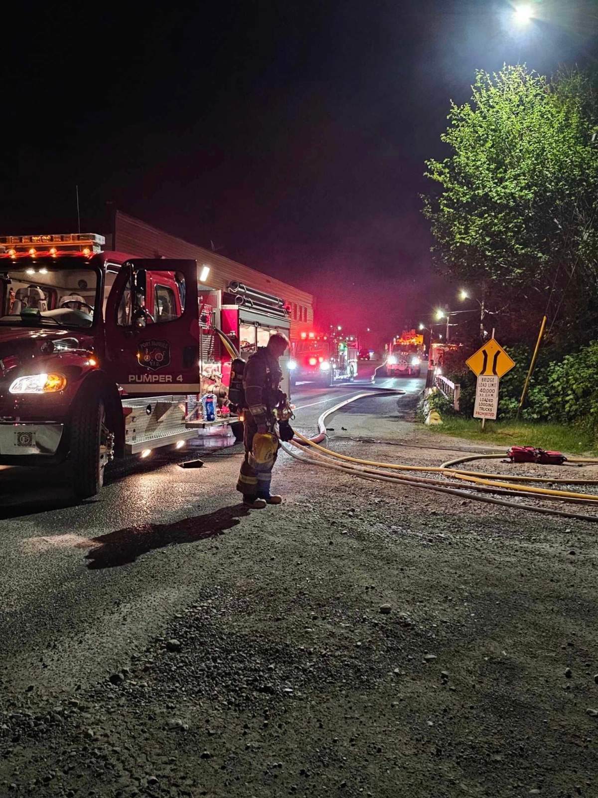 Port McNeill Fire Rescue on the scene of the fire at the world's largest burl, which was badly burned in a fire.
