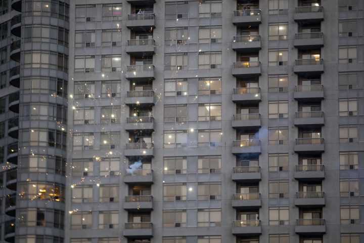 Fire crackers are let off from balconies in front of an apartment building in Mississauga on Tuesday, May 18, 2021.