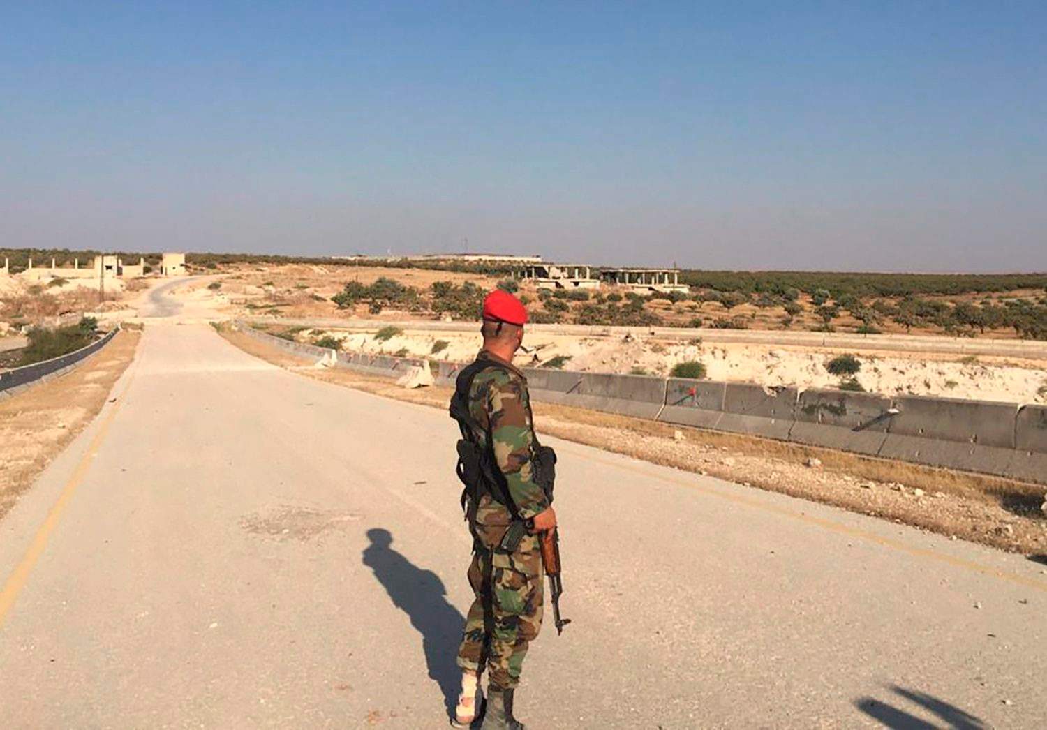 Syrian soldier in Khan Shaykhun, Syria. (AP Photo/Albert Aji)