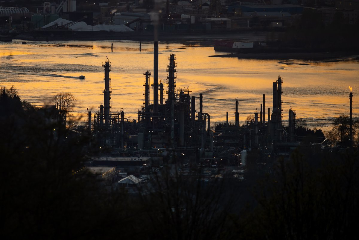 A boat travels past the Parkland Burnaby Refinery on Burrard Inlet at sunset in Burnaby, B.C., on Saturday, April 17, 2021.