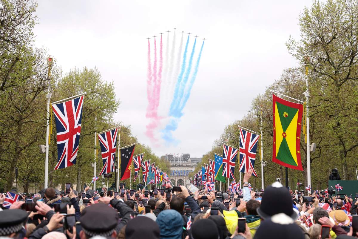 The Royal Air Force Aerobatic Team otherwise known as The Red Arrows fly over Buckingham Palace during the Coronation of King Charles III and Queen Camilla in London, Saturday, May 6, 2023. (Richard Heathcote, Pool via AP)