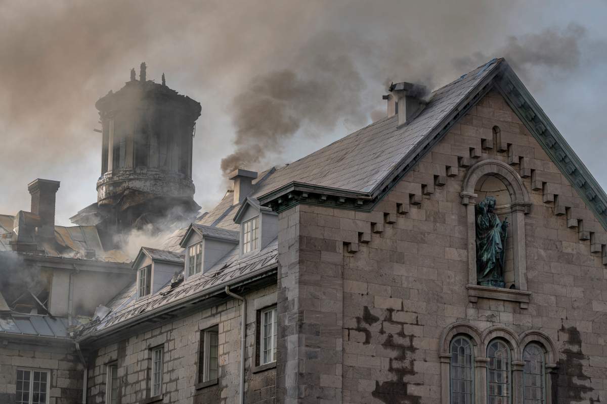 Firefighters respond to a five-alarm fire at the former Monastere du Bon Pasteur, a 19th century heritage building on Friday May 26, 2023 in Montreal.