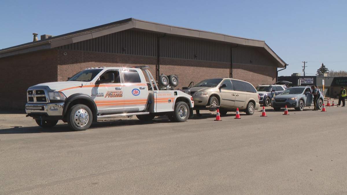 Light brown can being towed away from a Saskatoon police check stop.