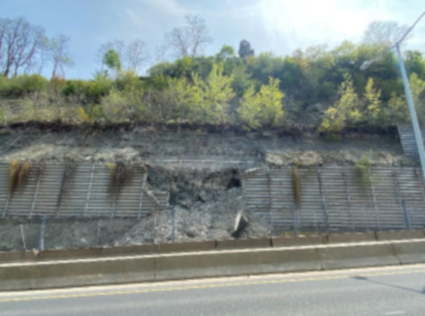 Photo of panels on the wall of the Claremont Access in Hamilton, Ont. that have failed and collapsed. The downbound lanes have been closed since March 1, 2023, following an engineering inspection that identified a high risk of failure near the thoroughfare.
