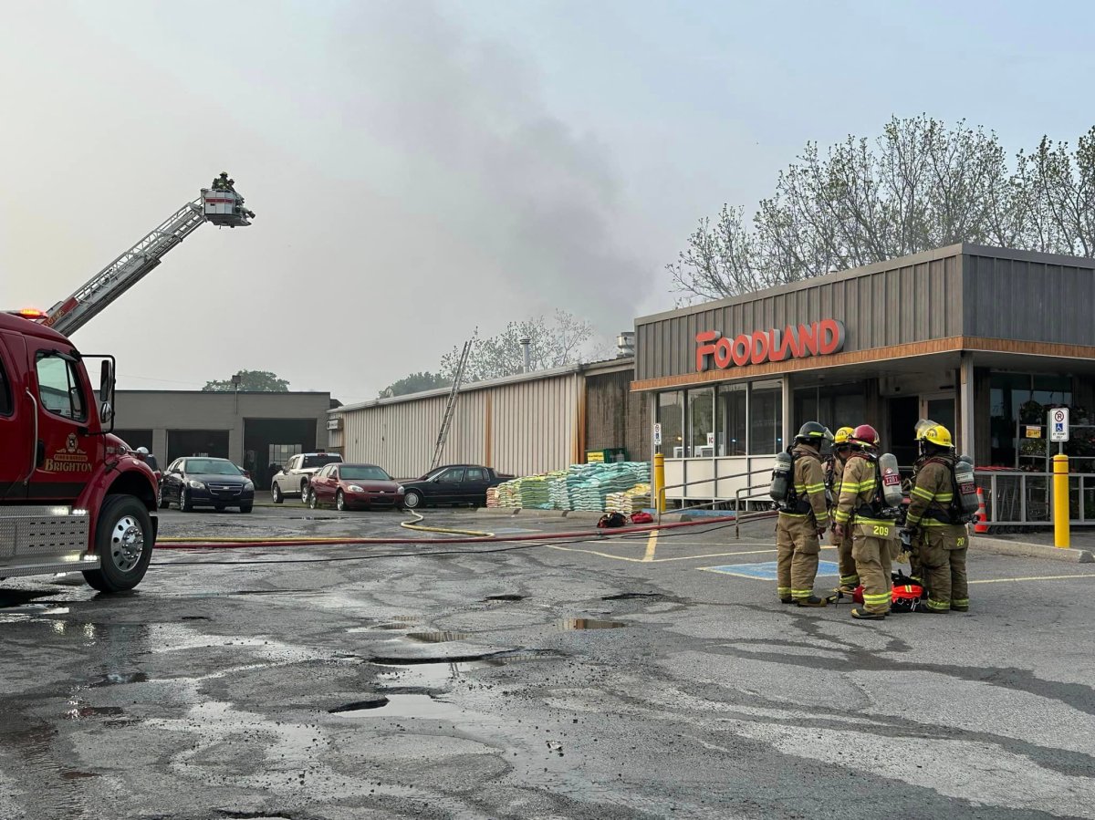 Cramahe Township firefighters tackle a fire at the Foodland grocery store in Colborne, Ont., on May 24, 2023. Sobeys, the parent company, has announced it will not reopening the store.