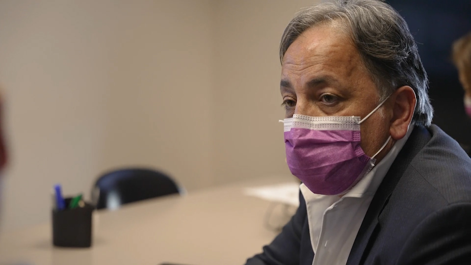 Dr. Amer Burhan, geriatric psychiatrist and physician in chief at Ontario Shores Centre, speaking with colleagues