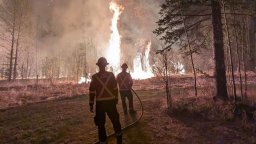 Firefighters battling the wildfire near Drayton Valley in Brazeau County, Alta. in May 2023.